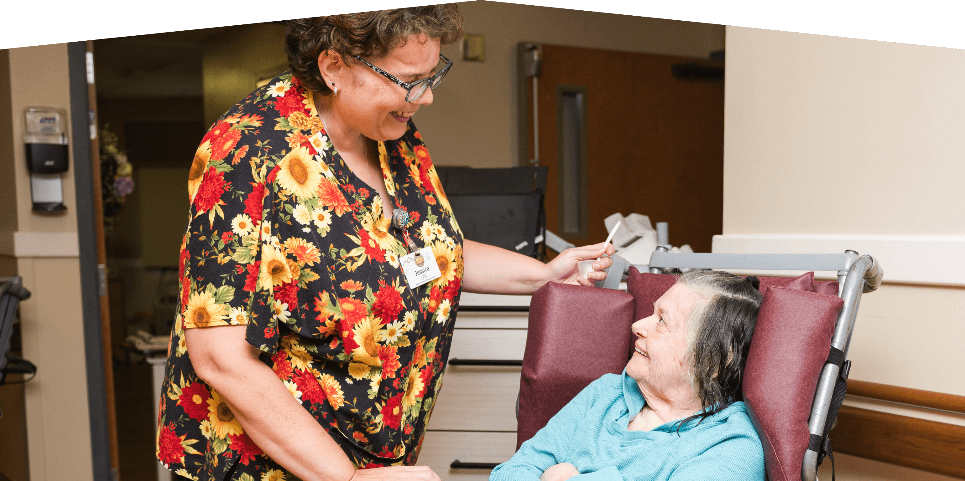 Staff member smiling at resident.