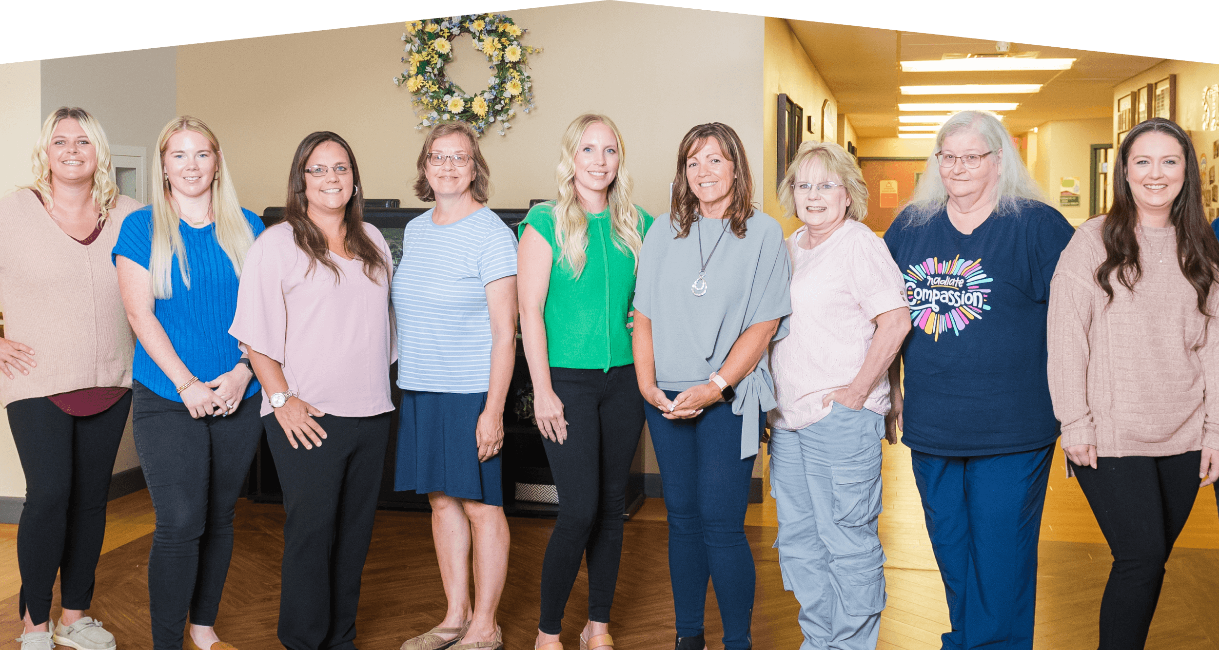 All staff members standing in a row.