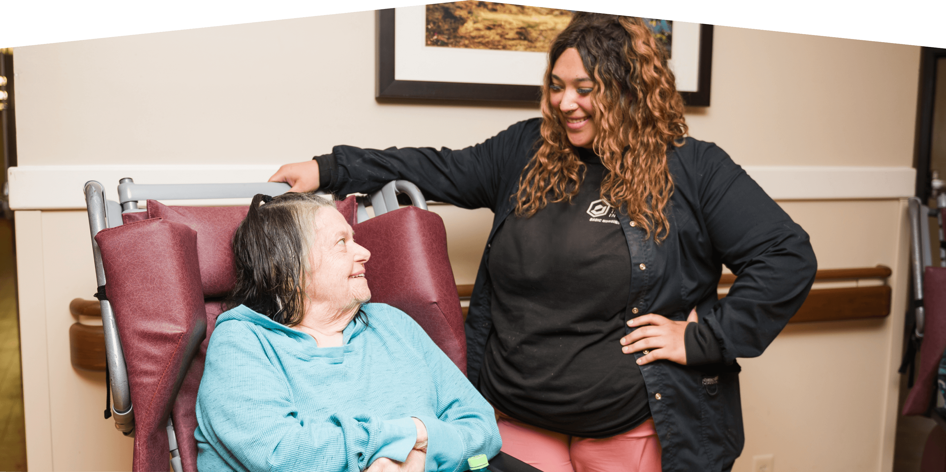 Staff member smiling at resident.